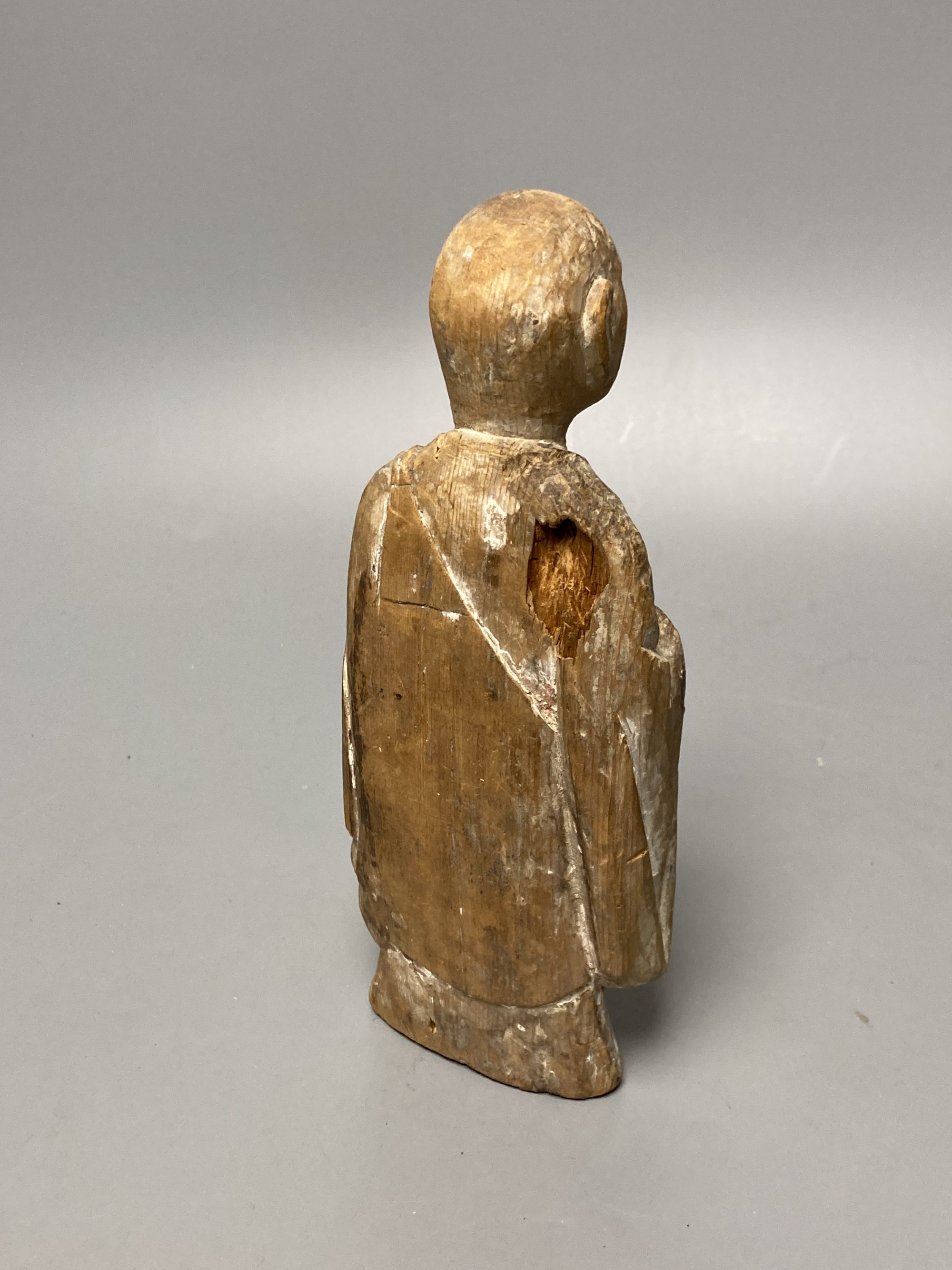 A Japanese polychrome wood figure, probably 14th / 16th century, height 20cm